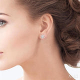 1/10 Ctw Petite Snowflake Round Cut Diamond Fashion Stud Earring in 10K White Gold