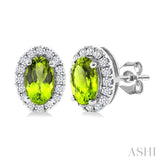 5x3 MM Oval Shape Peridot and 1/8 Ctw Round Cut Diamond Halo Semi-Precious Stud Earrings in 10K White Gold