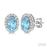 5x3 MM Oval Shape Aquamarine and 1/8 Ctw Round Cut Diamond Halo Semi-Precious Stud Earrings in 10K White Gold