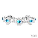 7X5 MM Oval Shape Blue Topaz and 1/10 Ctw Round Cut Diamond Bold Bracelet in Sterling Silver