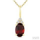 1/50 Ctw Oval Cut 6X4 MM Garnet and Round Cut Diamond Semi-Precious Pendant With Chain in 10K Yellow Gold