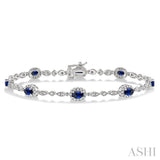 5x3 MM Oval Cut Sapphire and 1/20 Ctw Round Cut Diamond Bracelet in 10K White Gold