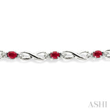 4x3 MM Oval Cut Ruby and 1/10 ctw Single Cut Diamond Bracelet in 10K White Gold