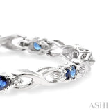 4x3 MM Oval Cut Sapphire and 1/10 ctw Single Cut Diamond Bracelet in 10K White Gold