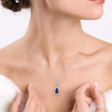 6x4 MM Pear Shape Sapphire and 1/10 ctw Round Cut Diamond Pendant in 10K White Gold with Chain