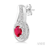 5x3 MM Oval Cut Ruby and 1/50 ctw Round Cut Diamond Earrings in Sterling Silver