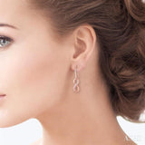 1/6 Ctw Round Cut Diamond Infinity Petite Earrings in 14K Rose Gold