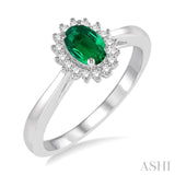 6X4 MM Oval Cut Emerald Center and 1/8 Ctw Round Cut Diamond Halo Precious Stone Ring in 10K White Gold