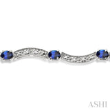 4x3 MM Oval Cut Sapphire and 1/10 ctw Single Cut Diamond Bracelet in 14K White Gold