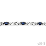 5x3 MM Oval Cut Sapphire and 1/10 ctw Single Cut Diamond Bracelet in 10K White Gold