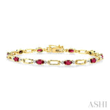 5x3 MM Oval Cut Ruby and 1/10 ctw Round Cut Diamond Precious Bracelet in 10K Yellow Gold