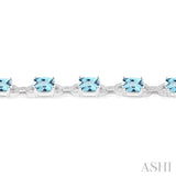 7X7 MM Cushion Shape Blue Topaz and 1/20 Ctw Round Cut Diamond Fashion Bracelet in Sterling Silver