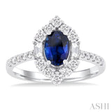 7x5 MM Oval Cut Sapphire & 5/8 ctw Baguette and Round Cut Diamond Halo Precious Ring in 14K White Gold