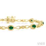 1/20 ctw Oval Cut 4X3MM Emerald and Round Cut Diamond Precious Fashion Bracelet in 10K Yellow Gold