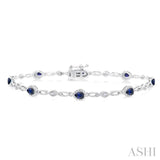 4X3 MM Pear Cut Sapphire and 1/20 ctw Round Cut Diamond Precious Fashion Bracelet in 10K White Gold