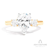 Bridal 3-Stone Pear Semi-Mount Engagement Ring With Round Side Diamonds in Yellow and White Gold