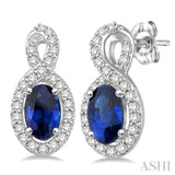 5x3 MM Oval Cut Sapphire and 1/5 Ctw Round Cut Diamond Earrings in 14K White Gold